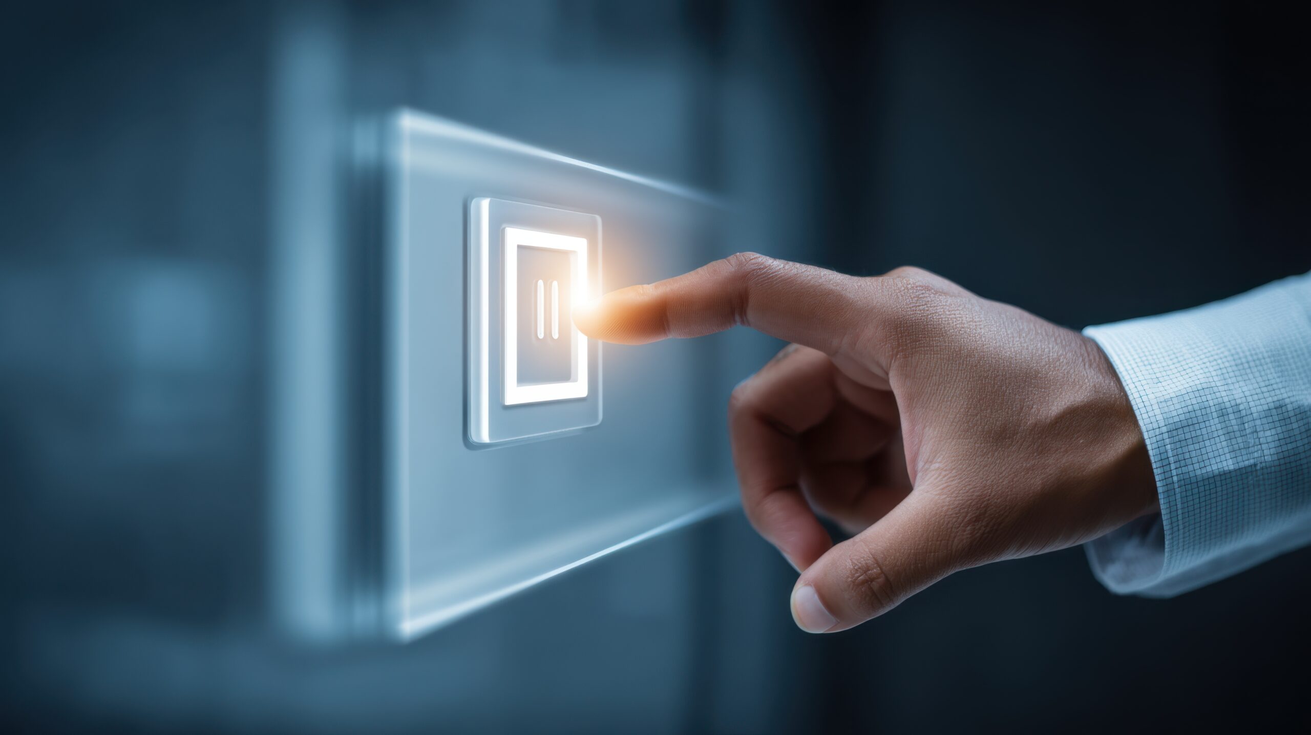close up of a hand touching a modern touchscreen control button with illuminated effect signifying technology and innovation in a digital environment